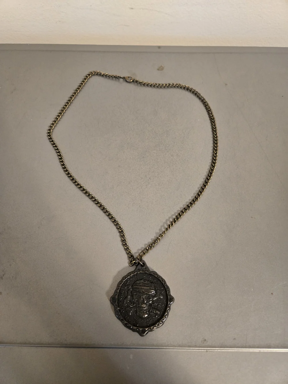 Disney Parks Pirates of the Caribbean Medallion The Pirates League Skull Pendant